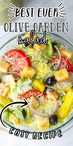 the best greek olive garden salad recipe is in a glass bowl with an arrow pointing to it