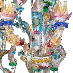 a glass chandelier with many different colors and designs on it's sides