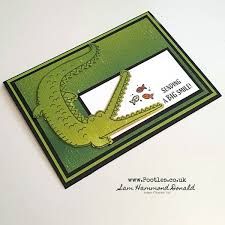 a close up of a card with an alligator on it