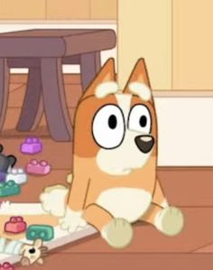 a cartoon dog sitting on the floor surrounded by toys