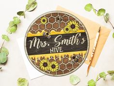 a wooden sign that says mrs smith's hive with sunflowers