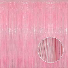 a pink background with white lines and a circular mirror in the center, as well as an image of a curtain