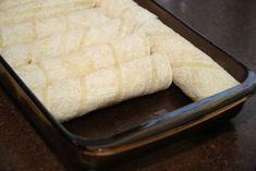 an uncooked pastry sitting in a pan on a table