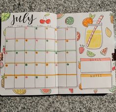 an open planner with fruit and drinks on it