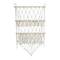 a white macrame hanging from the ceiling