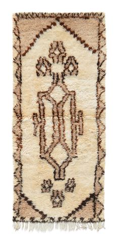 a rug with an ornate design and fringes on the bottom, in beige tones