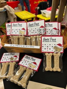 dog treats are on display for sale at a pet store in santa's hat