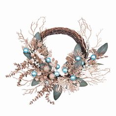 a wreath with blue balls and greenery on the front is decorated in gold, silver and white