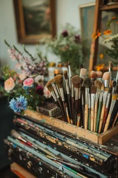 there are many brushes in the wooden box