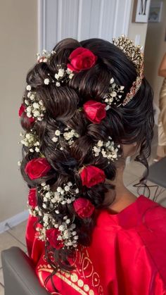 a woman with flowers in her hair is getting ready to go into the beauty salon