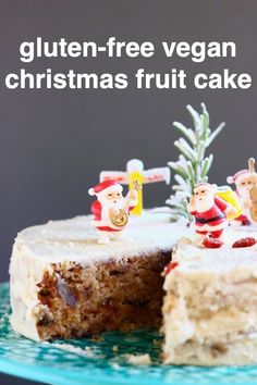 a cake with frosting and figurines on top is cut into pieces to look like santas