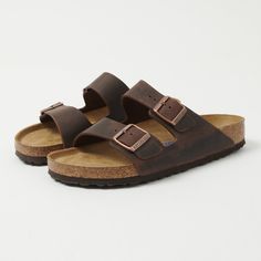 The Arizona from Birkenstock has rightly earned its place as a classic of comfort footwear. With a simple two strap design, an orthopaedic super-soft footbed, and EVA soul, this sandal is a great option for the summer months. The upper of this design is made from a thick oiled leather, while every single pair is still hand-made in Germany. Regular fit Thick oiled leather upper Two strap design Orthopaedic designed footbed EVA soul Twin metal pin buckles Product code: 0452761 Made in Germany Classic Leather Footbed Sandals With Arch Support, Classic Double Strap Sandals With Leather Footbed, Classic Double Strap Sandals With Cushioned Footbed, Comfortable Double Strap Cushioned Footbed Sandals, Comfortable Double Strap Leather Footbed Sandals, Classic Sandals With Cushioned Footbed, Classic Comfort Slip-on Footbed Sandals, Classic Cushioned Footbed Slip-on Sandals, Classic Cushioned Slip-on Footbed Sandals