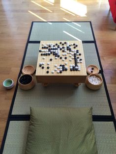 a game set up on top of a mat in the middle of a living room