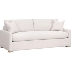 a white couch with pillows on it