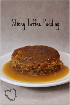 sticky toffe pudding on a white plate with caramel sauce and hearty topping