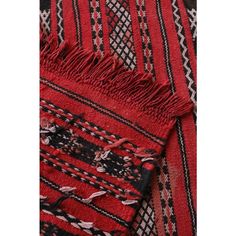 a red and black blanket with fringes