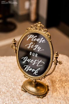 an old fashioned mirror with writing on it