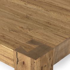 a close up of a wooden table with no one on it's legs or feet