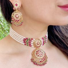 Featuring a ruby dominated choker set in 22k gold This timeless accessory creates a classic look with a touch of glamour, perfect for special occasions or everyday wear. The necklace weighs 41.7 gms including 1.71 gms in the hanging beads, 3.35 gms in stringing rubies and emeralds and 17.2 gms in the stringing pearls The earrings weigh 15.35 gms including 3.42 gms in the hanging ruby emerald beads Watch Product Video Price Breakup Summary Component Rupees % of Total 22k Gold 159,170 74.4% Stones Jadau Gold Necklace Set, 22k Gold Jewelry Necklaces, Jadau Jewellery, Beaded Watches, 22k Gold Jewelry, Hanging Beads, Pearl Necklace Set, Gold Designs, Emerald Bead