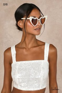 Become a matrimony muse with the Lulus Wedded Aesthetic Ivory Pearl Heart Cat-Eye Sunglasses! These adorable sunglasses have heart-shaped frames with tapered corners, forming a cat-eye silhouette. Luminous faux pearl details line the frames, with rosette details at the corners and ""bride to be"" spelled out in retro-inspired beads along the top. Brown-tinted lenses. 100% Acrylic. Imported. Lulus | Wedded Aesthetic Ivory Pearl Heart Cat-Eye Sunglasses. Silver Rhinestone Headband, Rhinestone Ear Cuff, Gold Rhinestone Earrings, Faux Fur Stole, Eye Silhouette, Heart Cat, Heart Shaped Frame, Wire Headband, Pearl Details