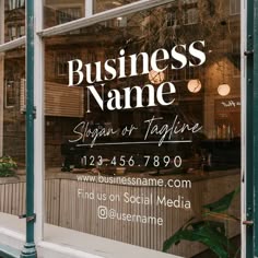 a business sign is in the window of a storefront that says, business name