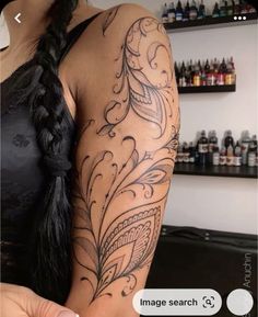 a woman with a tattoo on her arm