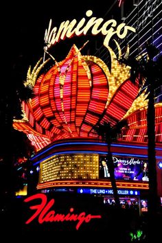 the las vegas hotel and casino sign lit up in red, yellow, and blue