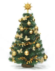 a small christmas tree with gold ornaments on it