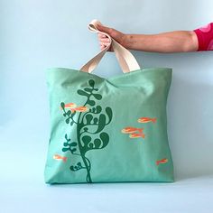 Upgrade your style with our Fish oversized tote bag. Perfect for carrying all your essentials in one stylish package. Get yours today! Oversized Tote Bag, Oversized Tote, Ocean Lover, Cotton Tea Towels, Work Environment, Large Tote Bag, Big Canvas, Sea Life, Retro Inspired