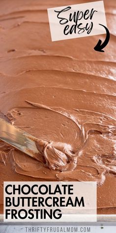 chocolate buttercream frosting is being spread on top of the cake with a spatula