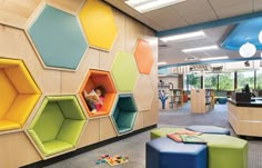 the children's library is decorated with colorful hexagonal shelves