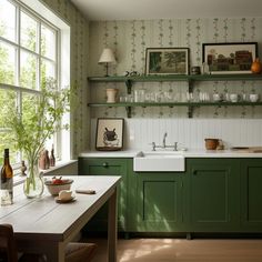 a kitchen filled with lots of green cabinets and counter top space next to a window