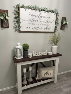 a white bench with some plants on it and a sign above it that says family means you will love and be loved for the rest of your life