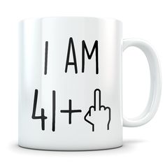 a white coffee mug with the words i am 31 and pointing up