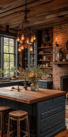 an old fashioned kitchen with brick walls and wood flooring, large center island surrounded by stools