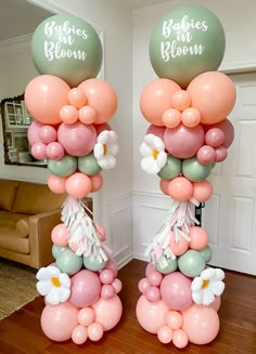 two large balloons with flowers on them in the living room