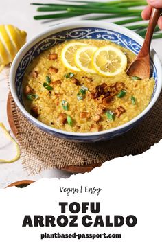 a close up of a bowl of food with lemons on the side and text that reads vegan every tofu arroz galloo