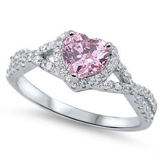 a heart shaped diamond ring with diamonds on the band and an intertwined band around it