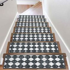 the stairs are decorated with black and white rugs