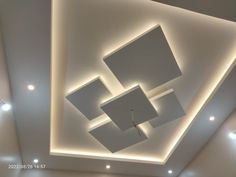 the ceiling is decorated with square and rectangle shapes