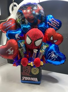 a spiderman balloon bouquet in a box