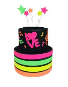 a multicolored cake with music notes and stars on it