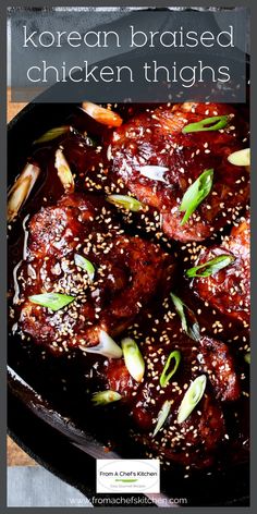 korean chicken thighs with sesame seeds in a black skillet on a wooden table and text overlay