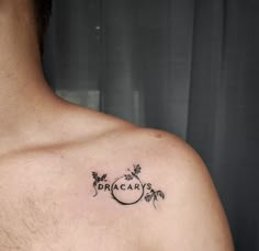 a man with a tattoo on his chest that says origaryss and leaves