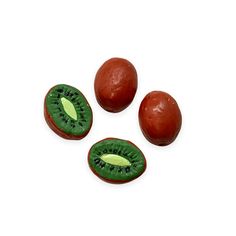 three pieces of kiwi fruit on a white background