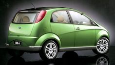 a small green car is shown in this image