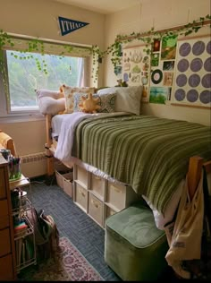 a bedroom with a bed and lots of storage boxes on the bottom floor, next to a window