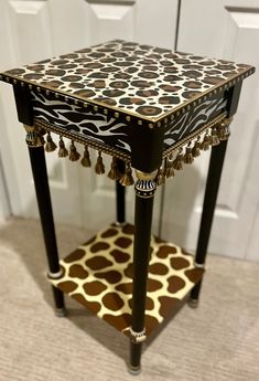 a black and white table sitting on top of a carpeted floor next to a door