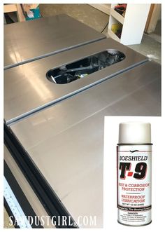 a can of t - 9 spray paint next to a metal table with the door open