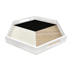 a white box with black and wood in the bottom, on a white background that is also used as a serving tray